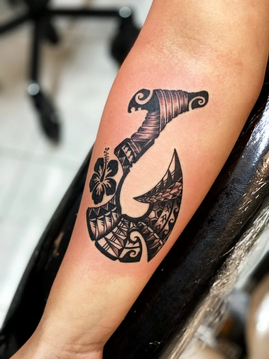 Black & Grey Polynesian fish hook (makau) with hibiscus tattoo on calf by 2bit (Chris Curren) at Lost at Sea Tattoo, Chinatown, Honolulu Black & Grey Polynesian fish hook (makau) with hibiscus tattoo on calf by 2bit (Chris Curren) at Lost at Sea Tattoo, Chinatown, Honolulu