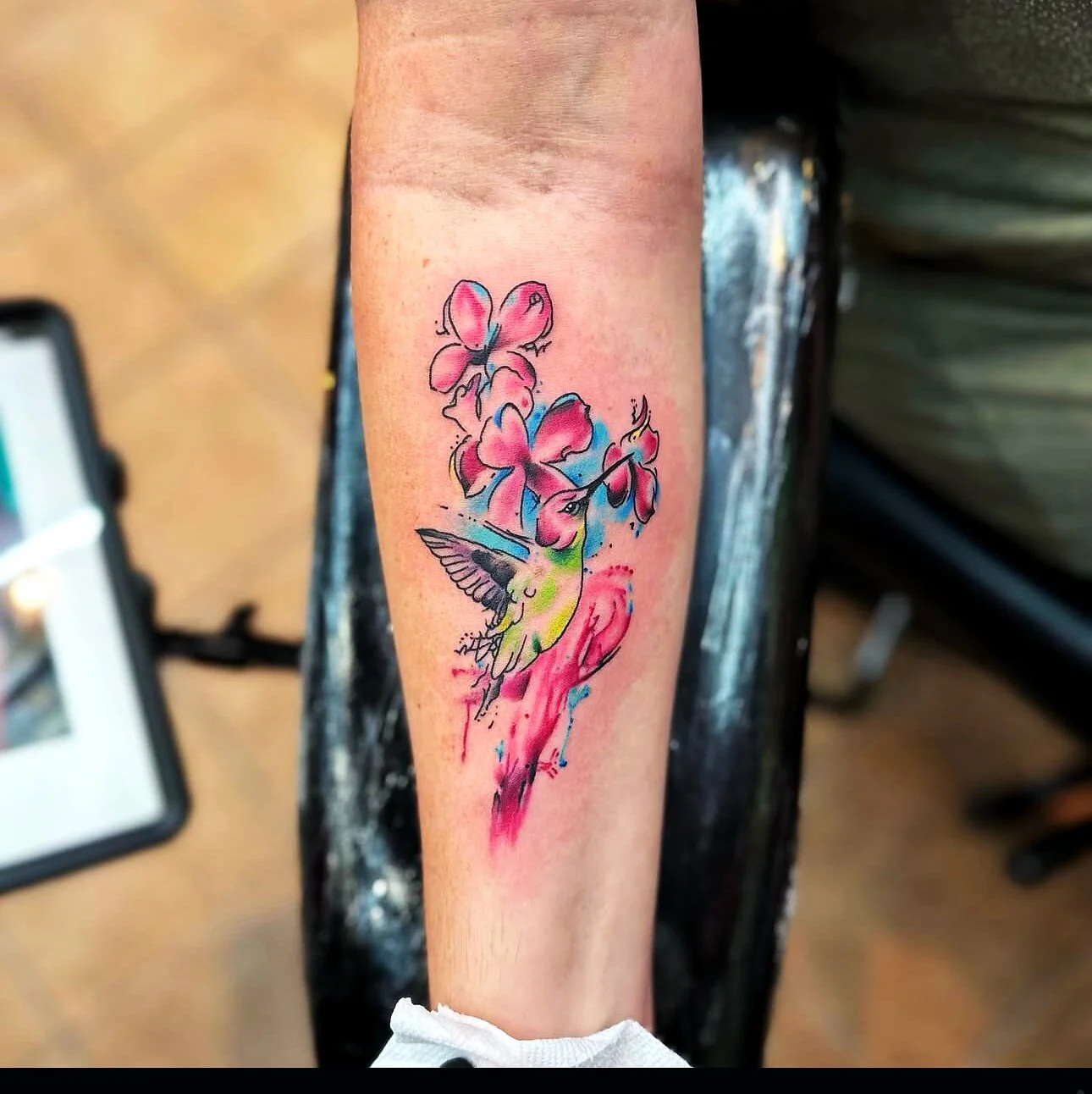 Illustrative watercolor hummingbird with hibiscus tattoo on forearm by 2bit (Chris Curren) at Lost at Sea Tattoo, Chinatown, Honolulu Illustrative watercolor hummingbird with hibiscus tattoo on forearm by 2bit (Chris Curren) at Lost at Sea Tattoo, Chinatown, Honolulu